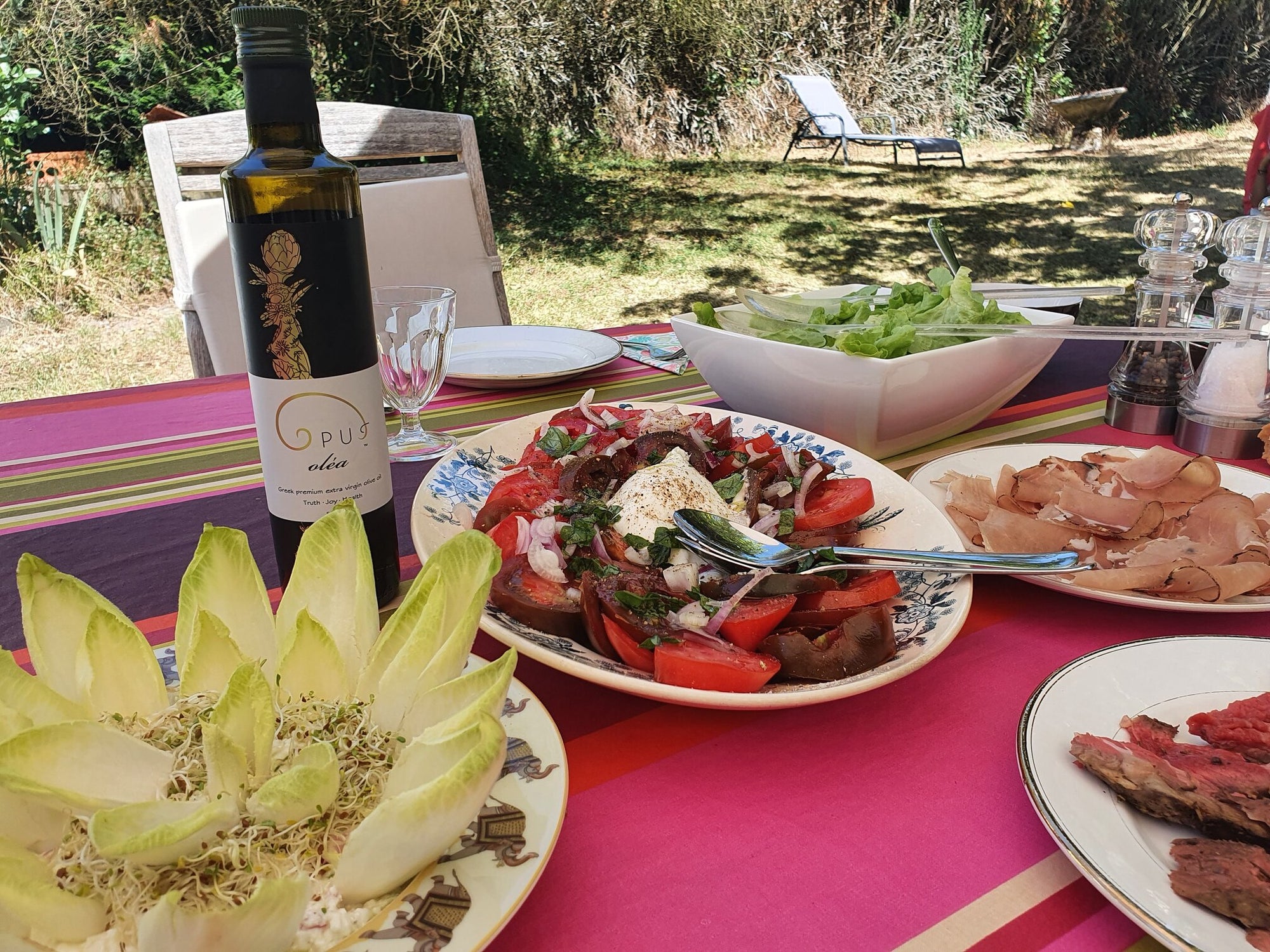 opus olea olive oil on garden lunch table