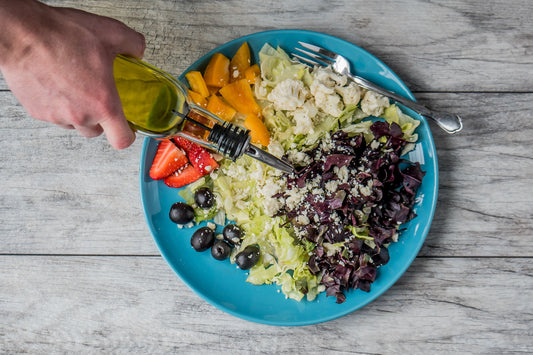 putting olive oil on food