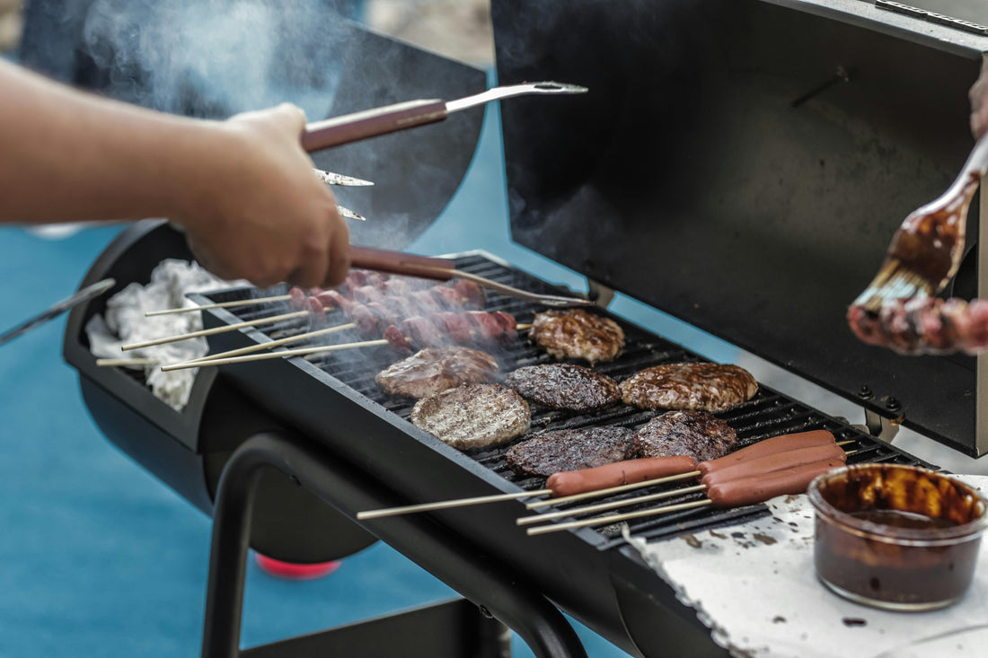 Barbeque (BBQ) grill with different meats being grilled