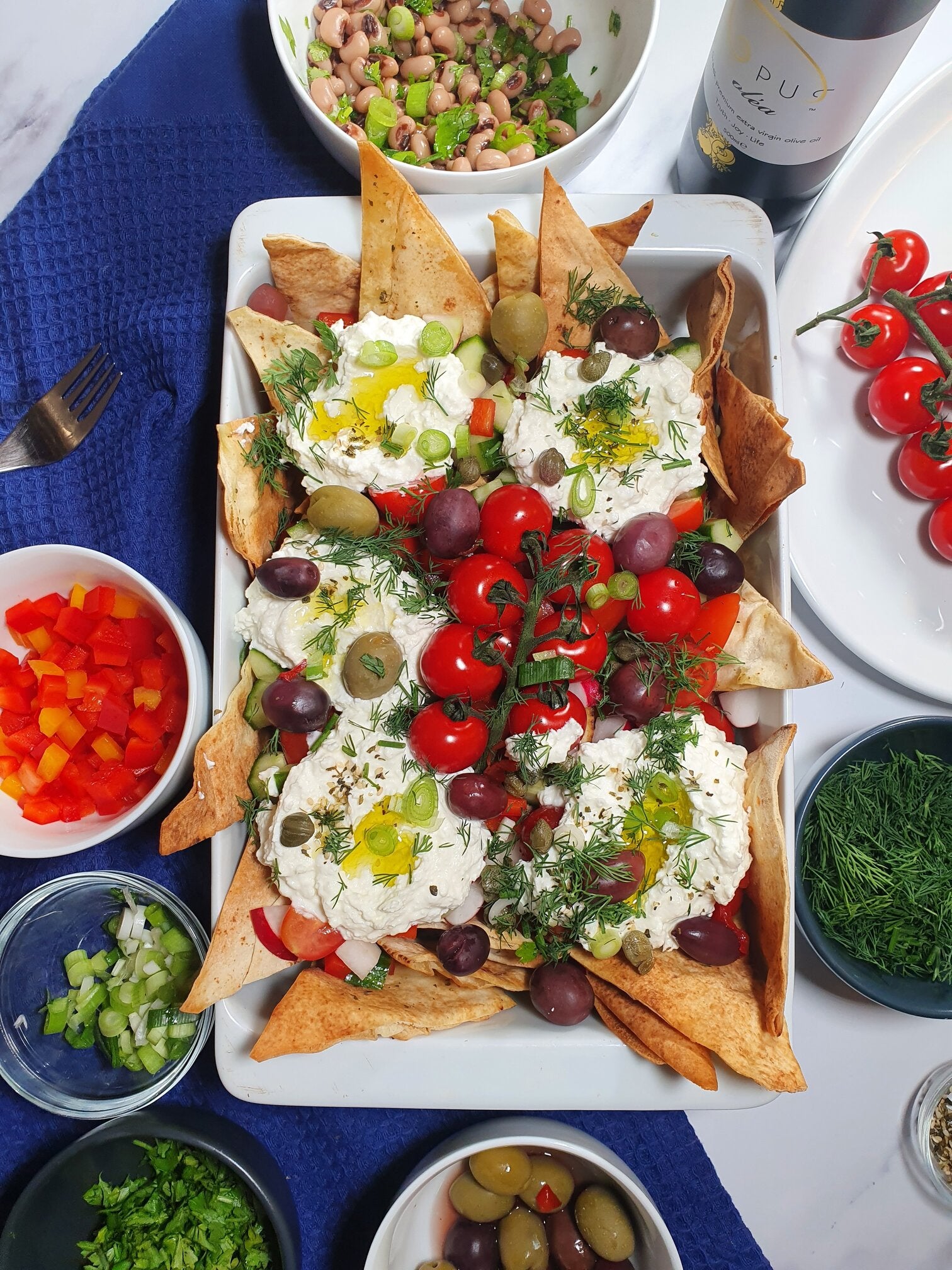 Greek summer inspired nachos with Opus Olea extra virgin olive oil